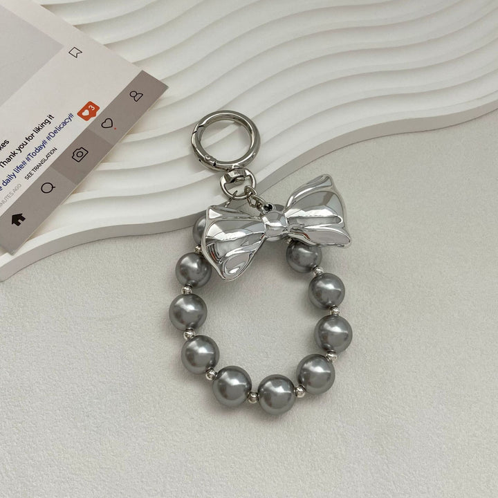 Elegant Pearl Bow Keychain Stornfield