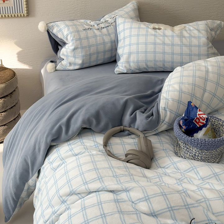 Plush bedding set with embroidered dog motif and striped cuddle blanket