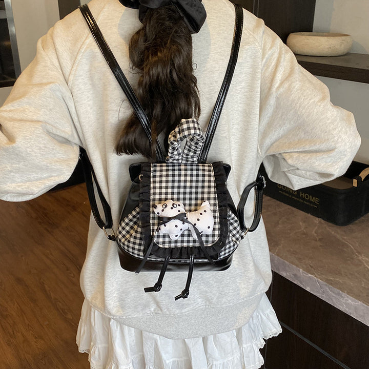 Playful backpack with checkered pattern and animal appliqué Stornfield