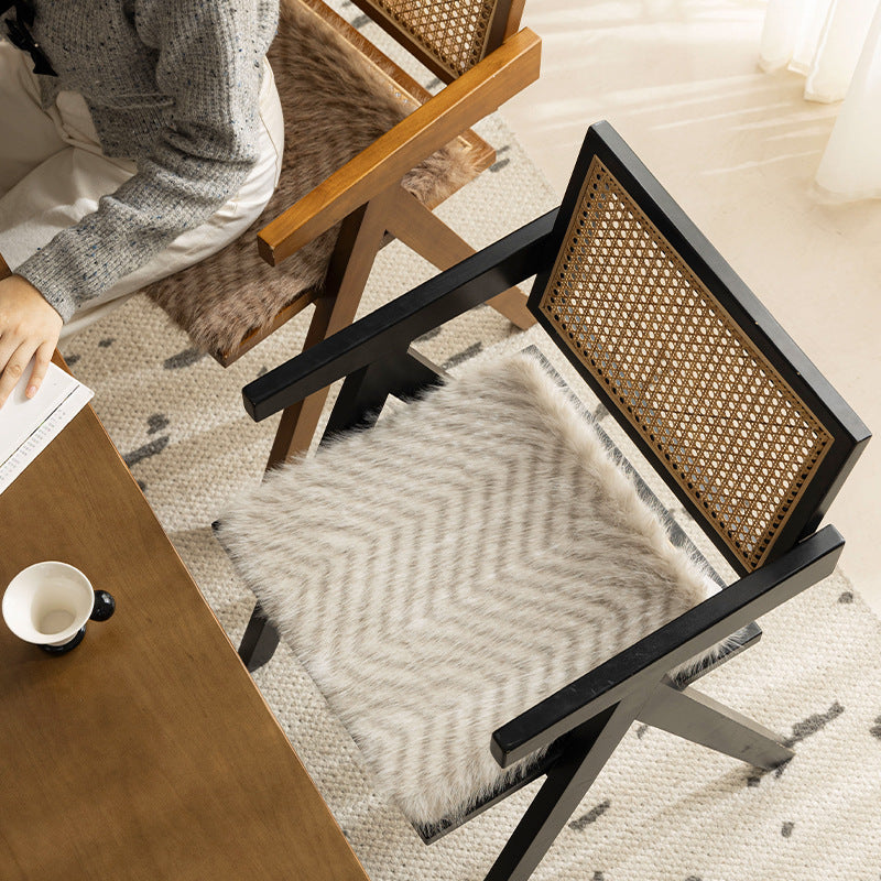 Square chair cushion made of cozy artificial fur with non-slip base and strap attachment Stornfield