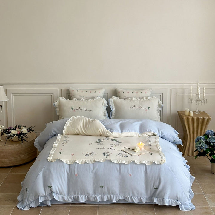 Cotton bedding set in country house style with ruffle edge and fine floral embroidery Stornfield