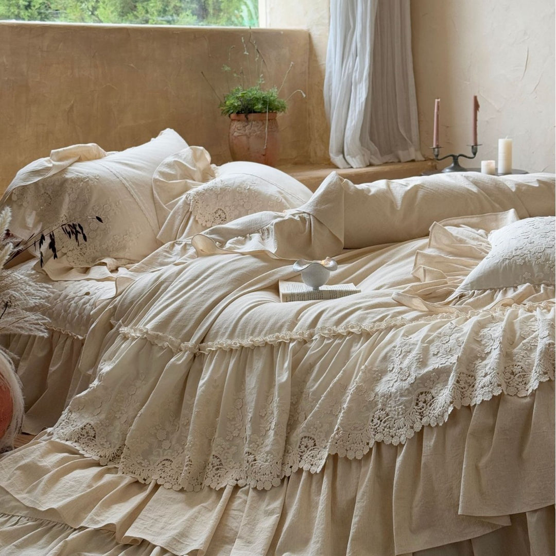 Vintage-inspired duvet cover set with layered ruffles and lace appliqué
