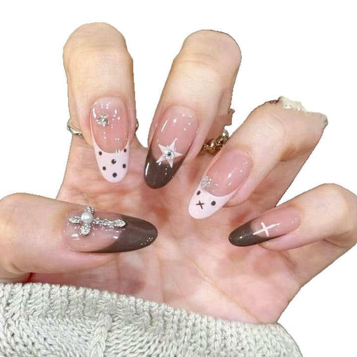 Artificial nails with creative design and sparkling accents Stornfield
