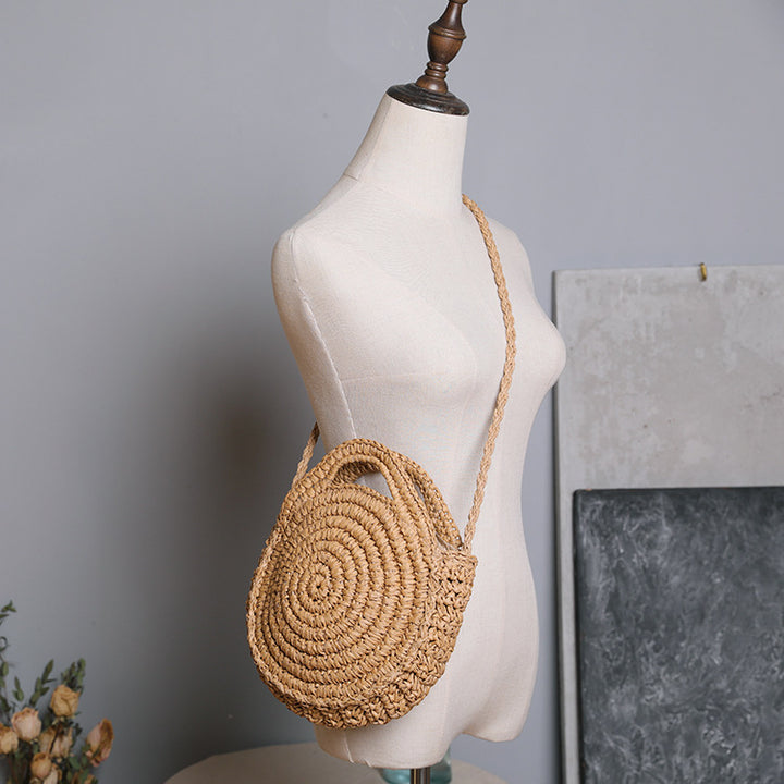 Handcrafted Round Wicker Bag with Elegant Closure Stornfield
