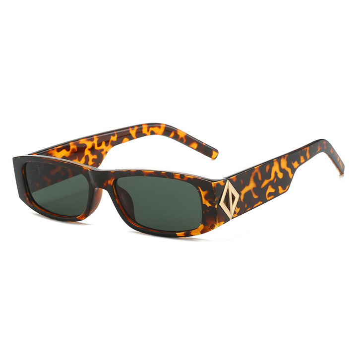 Ladies fashionable sunglasses with asymmetrical frame and gold-colored details Stornfield