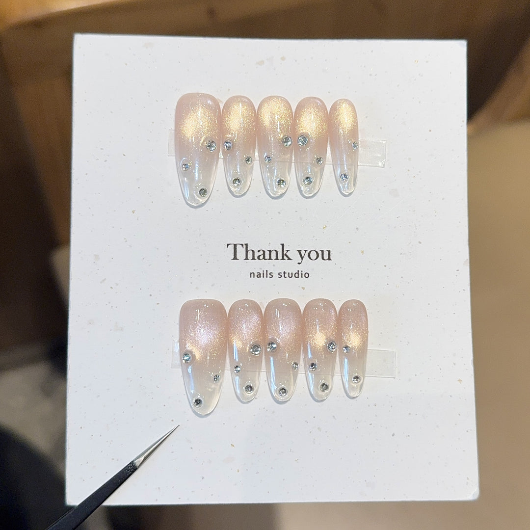 Artificial nails with shimmering accents and elegant rhinestone details Stornfield