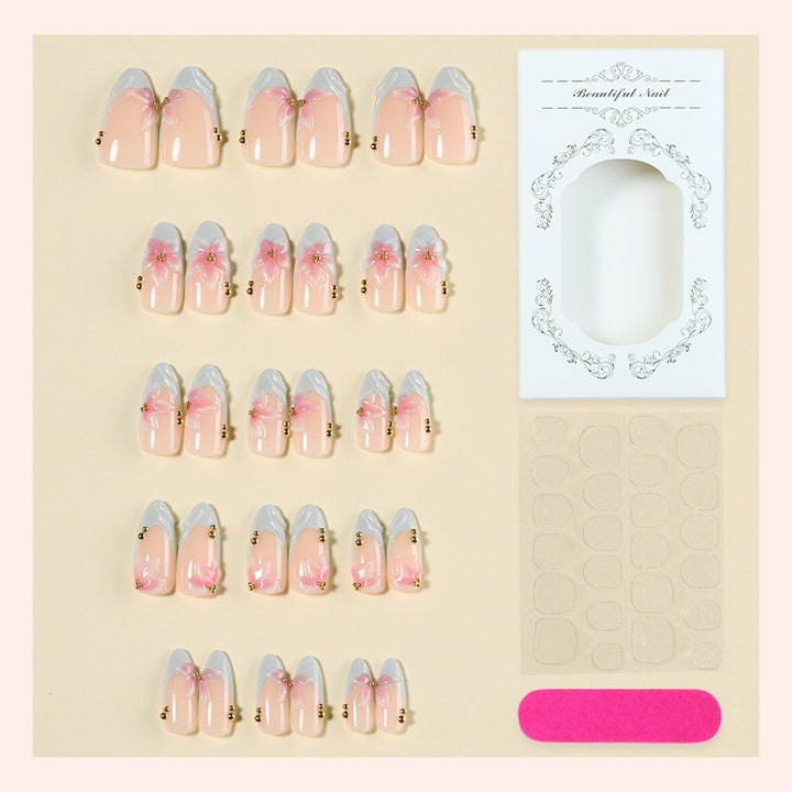 Creative nail art set with delicate flower design and glitter accents Stornfield