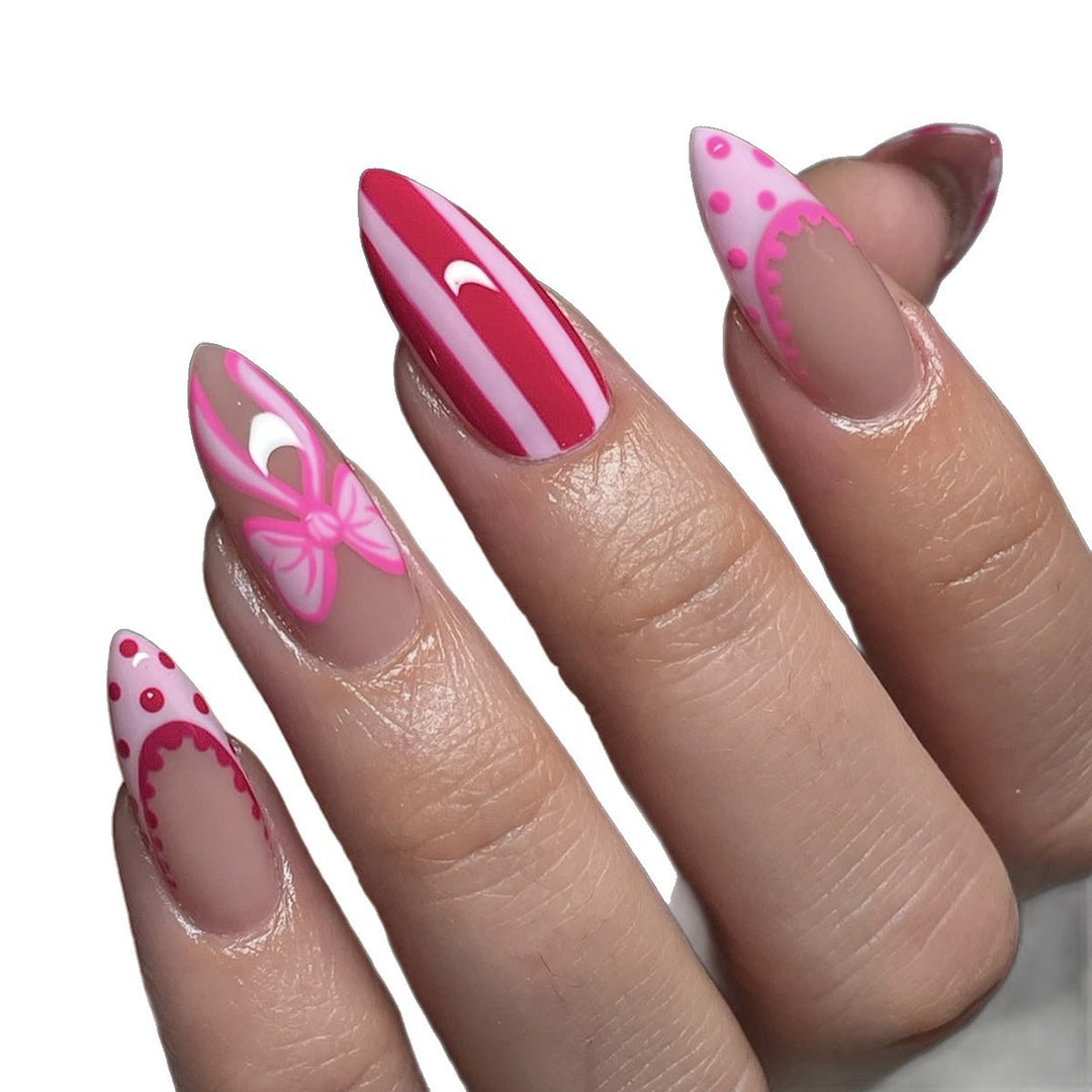 Nail set with playful bow and stripe pattern Stornfield