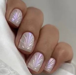 Acrylic nail set with elegant pearl details and fine floral patterns Stornfield
