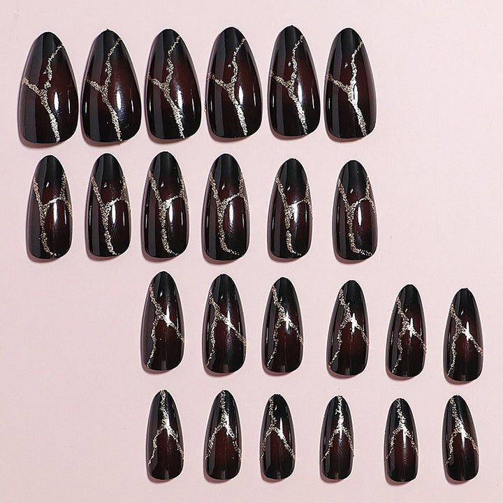 Artistic Press-On Nail Design with Gold Veining Accents Stornfield