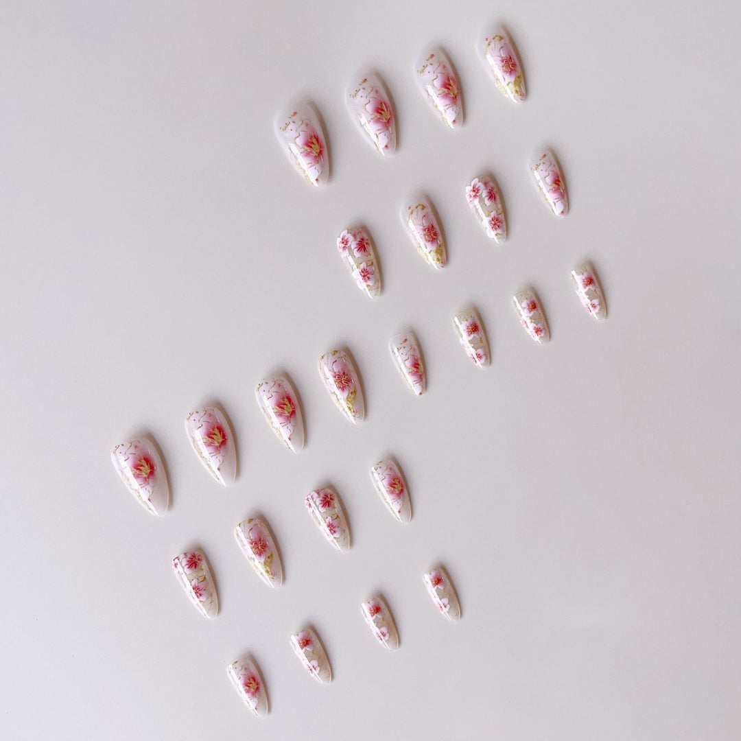 Artificial nails with floral accents and golden details Stornfield