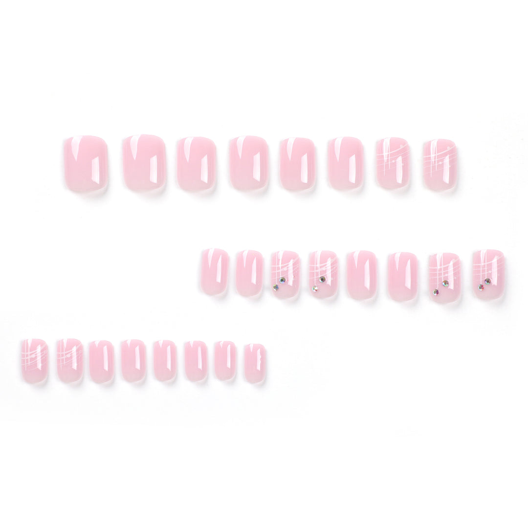 Artful nail extensions with elegant design and rhinestone embellishments Stornfield