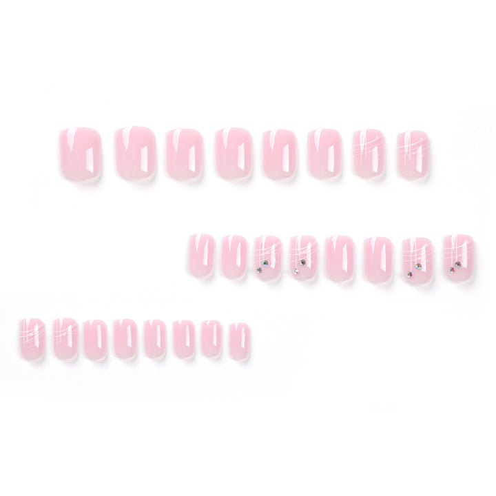 Artful nail extensions with elegant design and rhinestone embellishments Stornfield