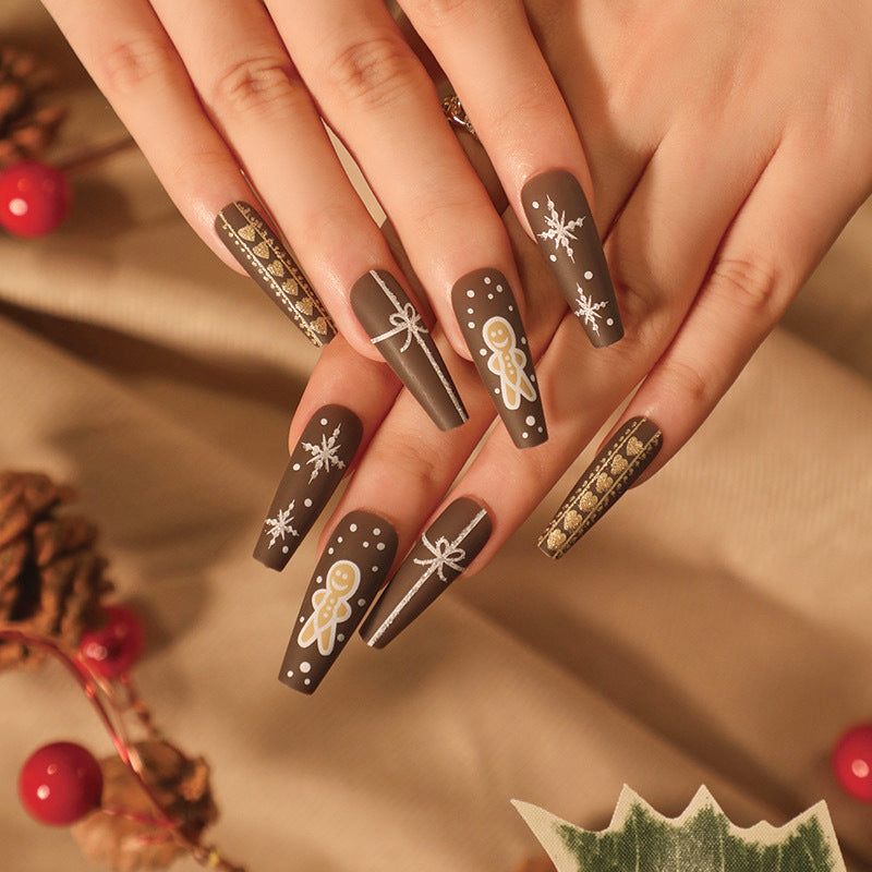 Artificial nail art with festive gingerbread design Stornfield