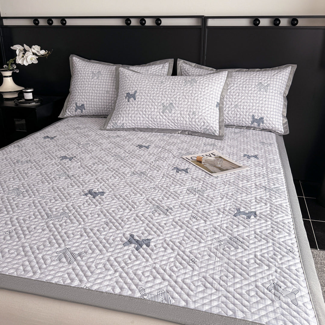 Quilted bedspread and pillow set with geometric striped quilting