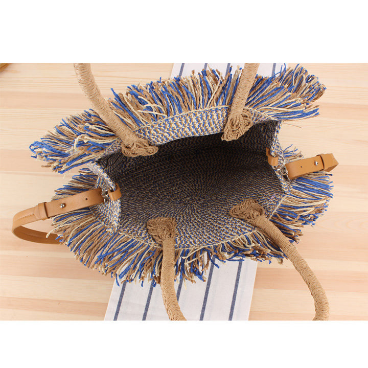 Round Bast shoulder bag with fringes and leather handles Stornfield