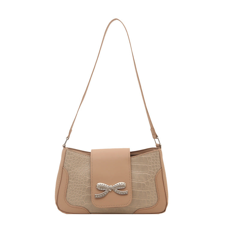 Elegant Crocodile-Patterned Handbag with Bow Detail
