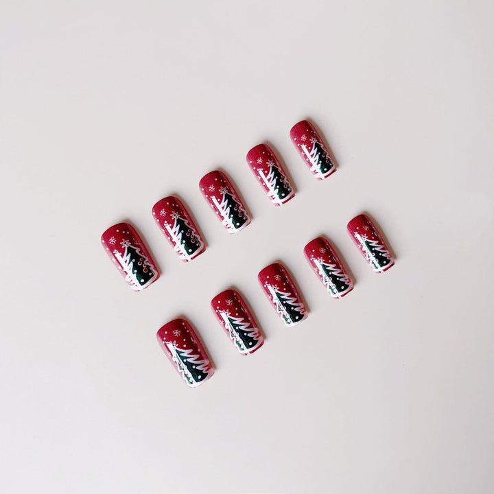 Artificial nail set with festive Christmas designs and glitter accents Stornfield