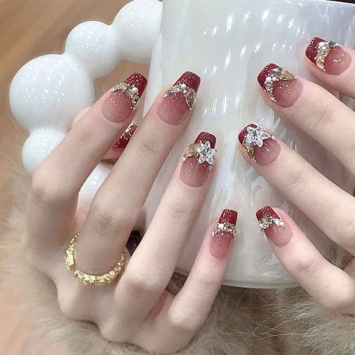 Artistic Press-On Nail Design with Gemstone Accents Stornfield