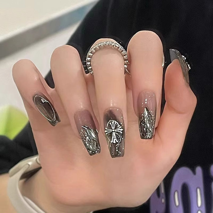 Glamorous artificial nails with heart design and glittering accents Stornfield