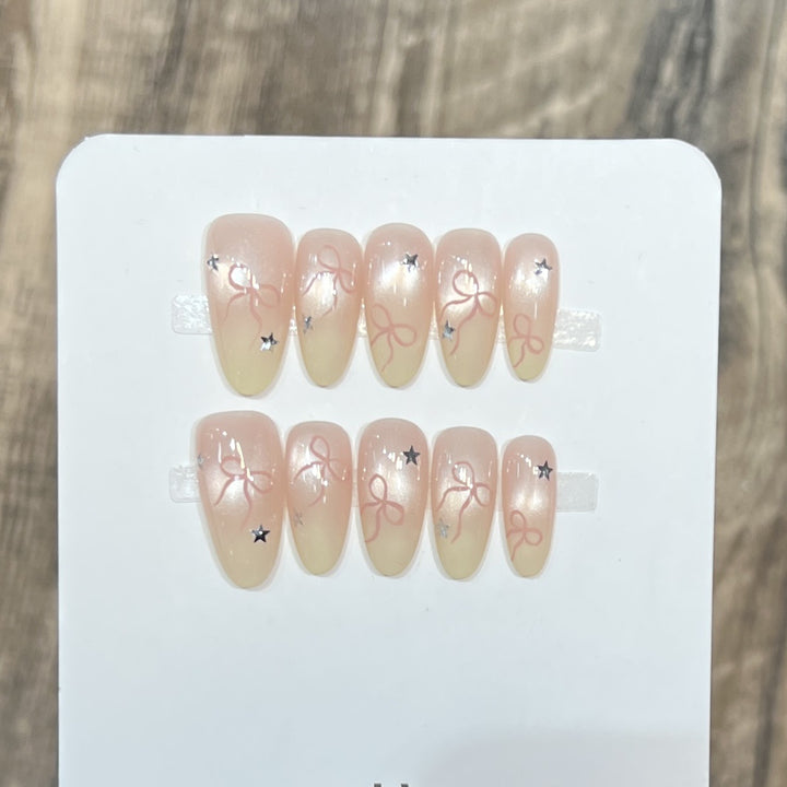 Press-On Nail Set with Bow and Star Accents Stornfield