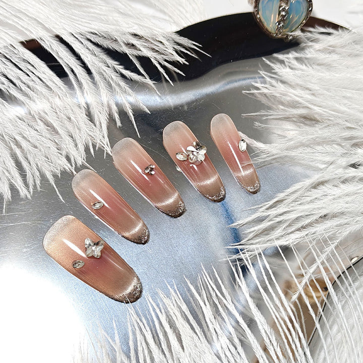 Glamorous artificial nails with rhinestone decorations Stornfield