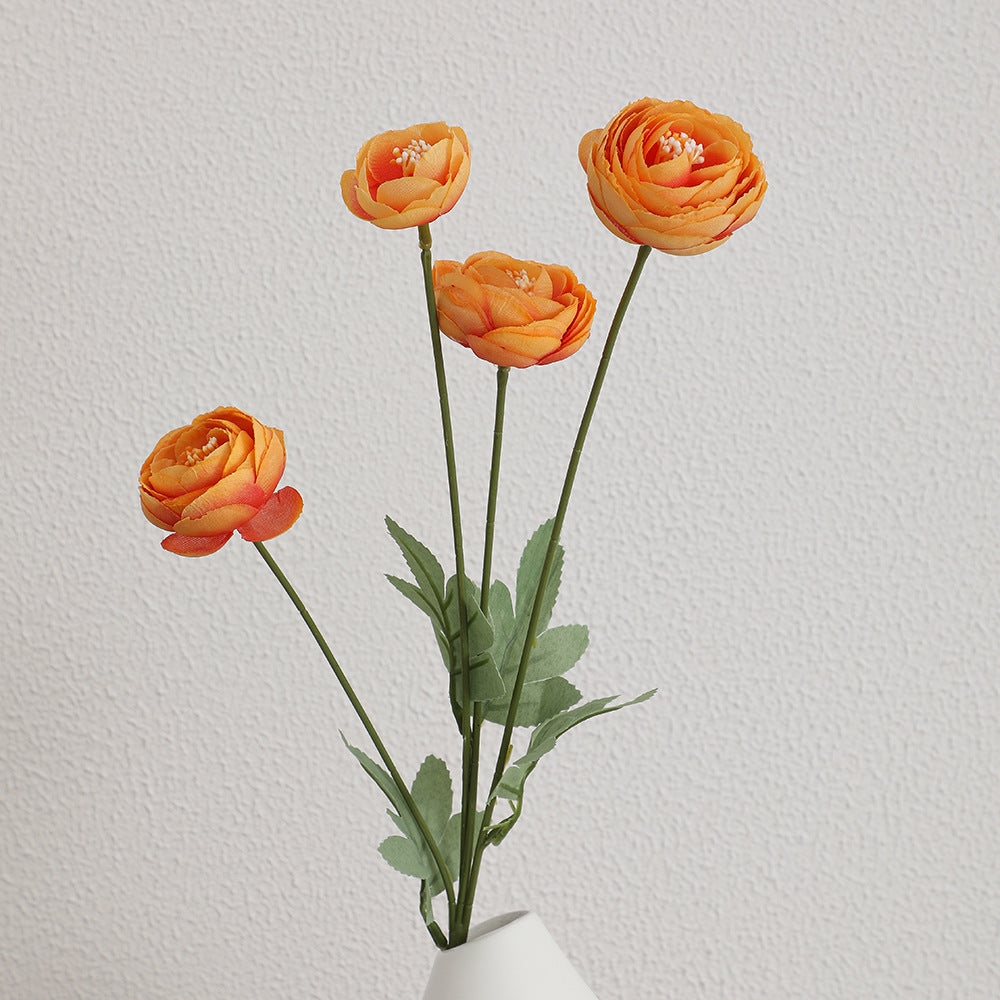 Decorative artificial flower bouquet with intricately detailed ranunculus