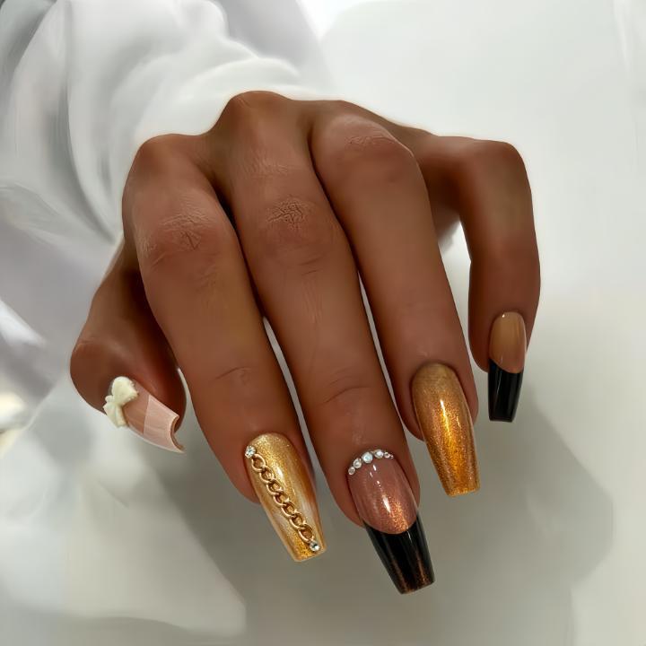 Glamorous artificial nails with glittering design and elegant embellishments Stornfield