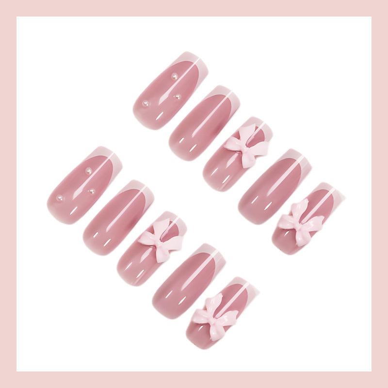 Nail art set with playful ribbon designs and elegant accents Stornfield