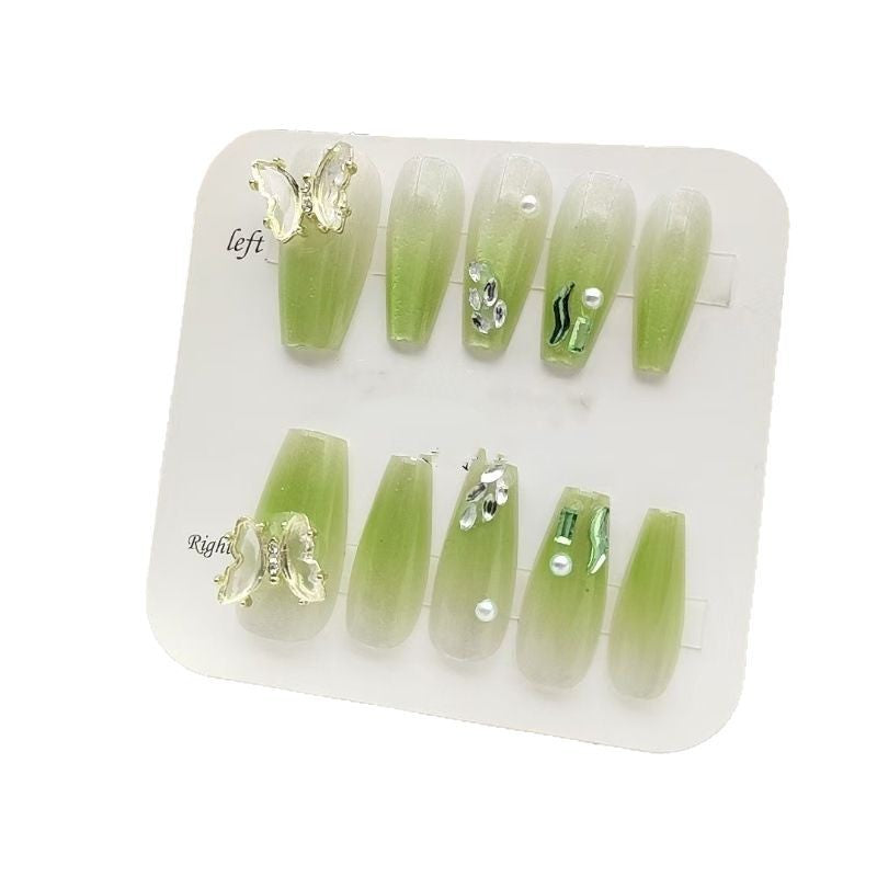 Artificial nails with butterfly accents and glitter details Stornfield