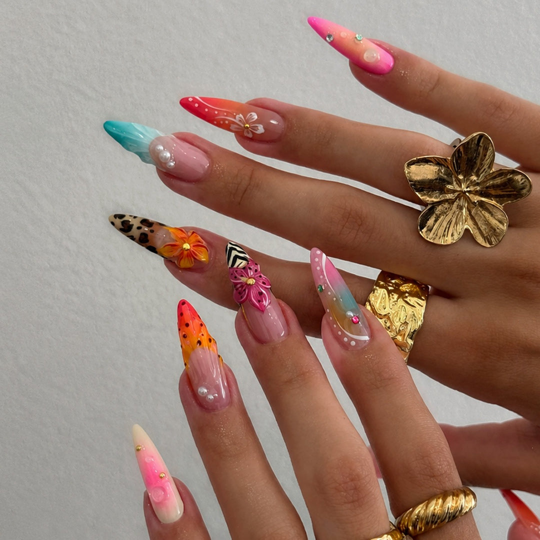 Acrylic nail set with creative floral design and glitter elements Stornfield