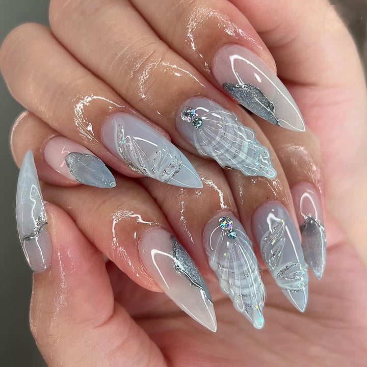 Artful stiletto nails with elegant glitter and floral design Stornfield