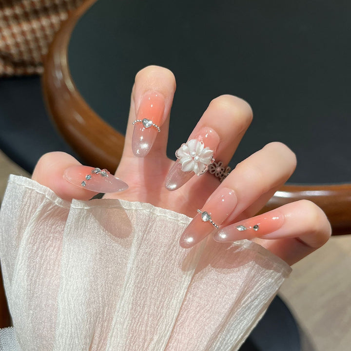 Elegant Nail Art Extensions with Pearl Accents Stornfield