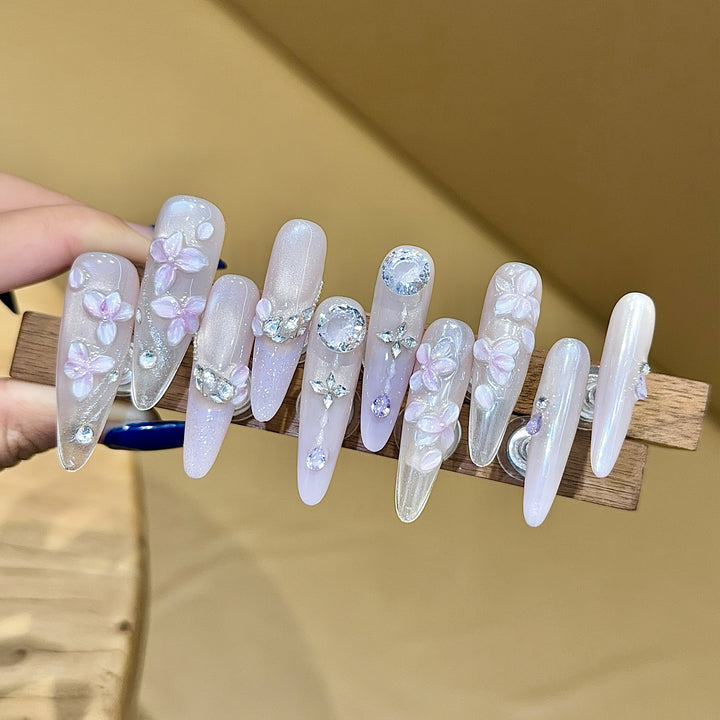 Artificial nails with delicate flower design and glitter accents Stornfield