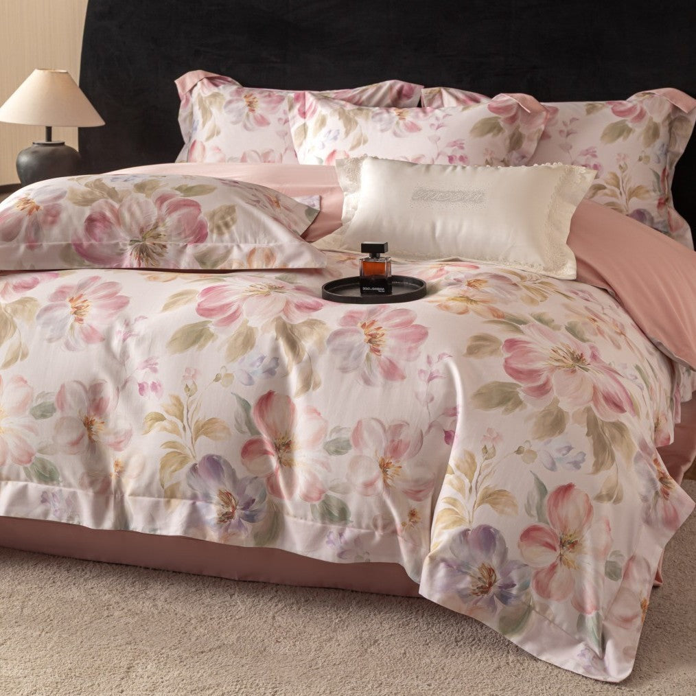 Cotton satin bedding set with watercolor flower print and reversible blanket