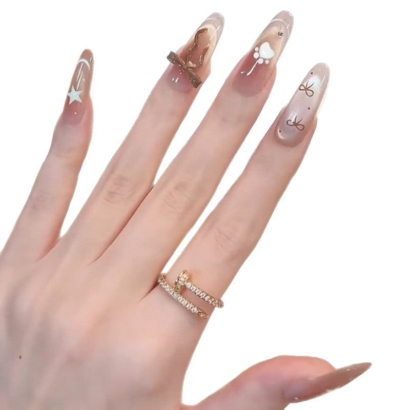 Glamorous artificial nails with creative embellishments Stornfield