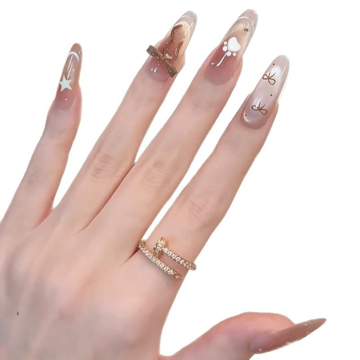 Glamorous artificial nails with creative embellishments Stornfield