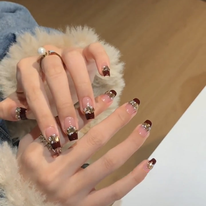 Artful nail extensions with glitter and jewelry embellishments Stornfield