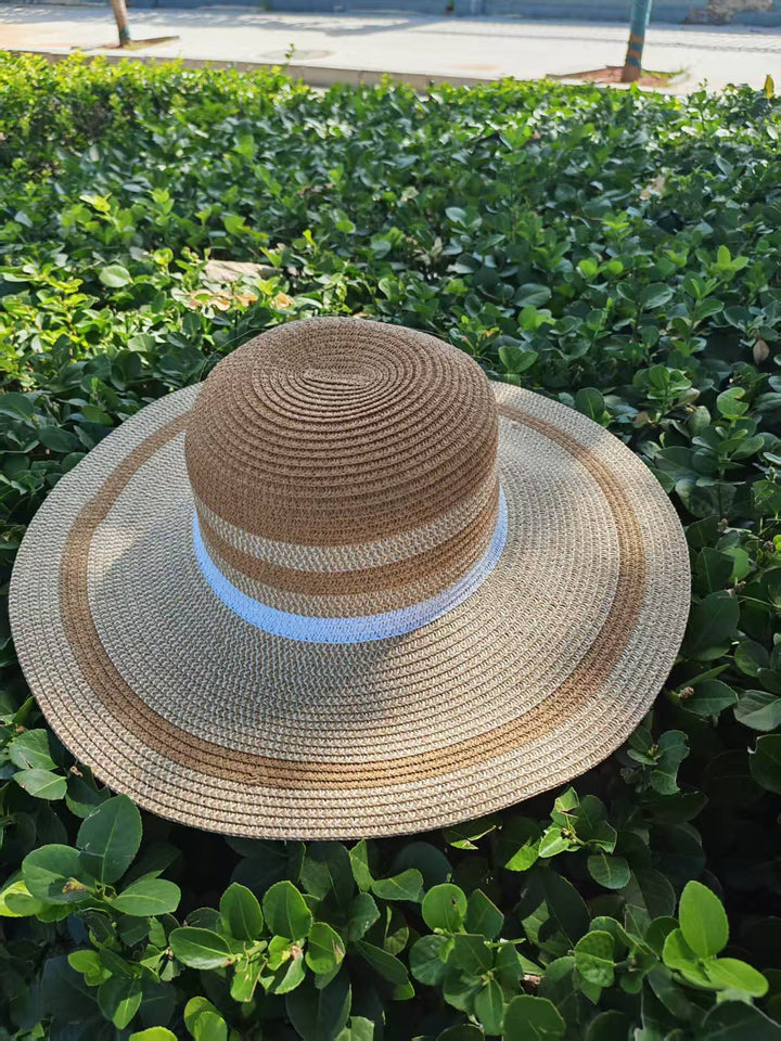 Elegant sun hat with wide brim and subtle stripe pattern Stornfield