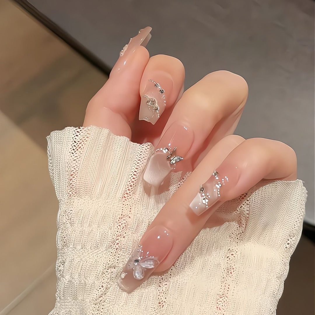 Artificial nails with glamorous decorations and shine Stornfield