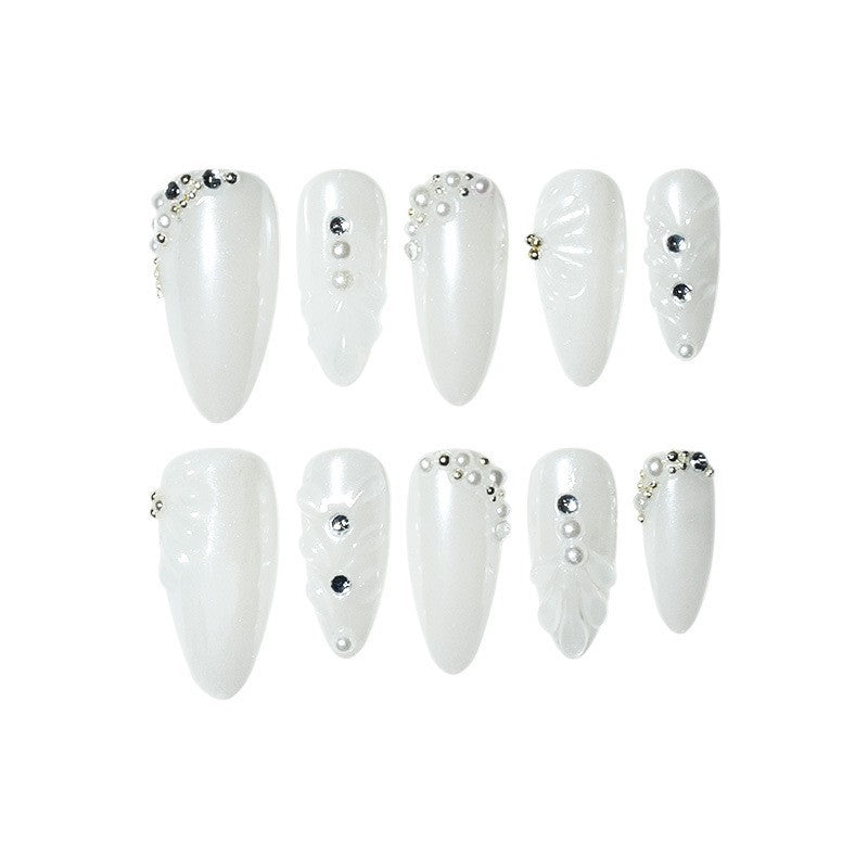 Elegant Stiletto Nail Enhancements with Decorative Pearls Stornfield