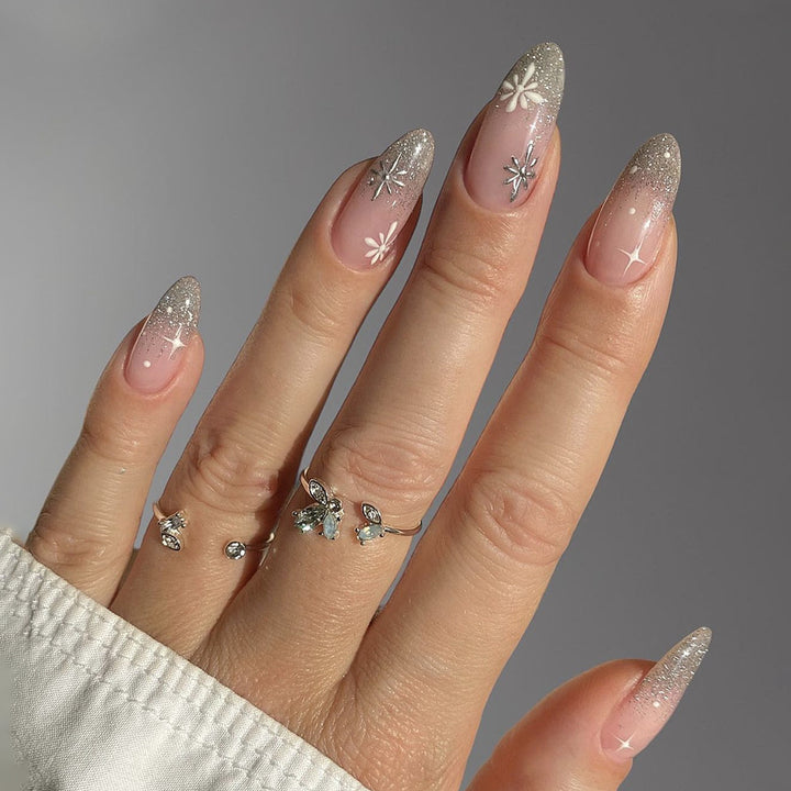 Nail art set with elegant glitter French design and artistic embellishments Stornfield