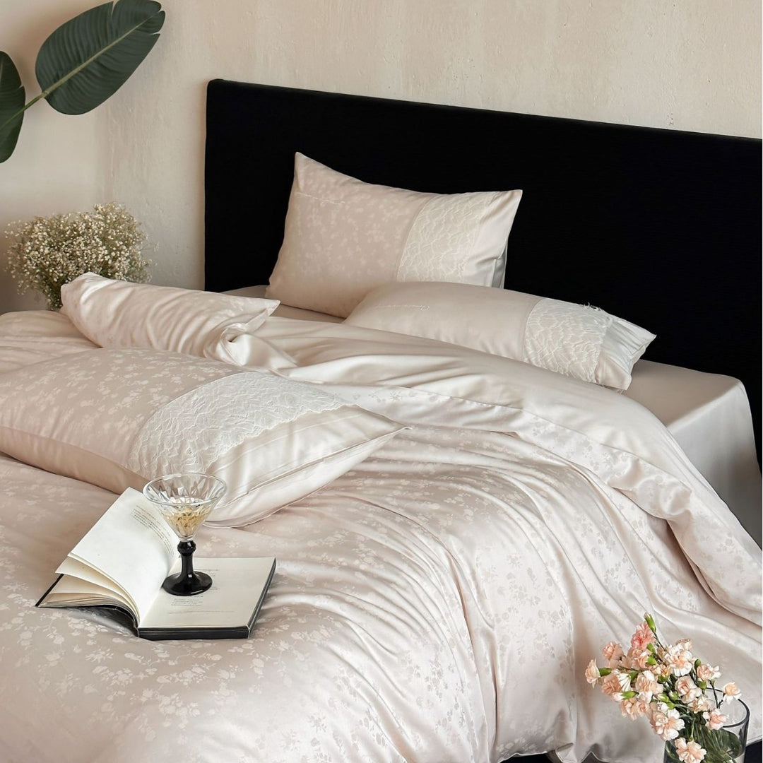 Satin bed set with subtle floral jacquard, reversible look and elegant piping seam