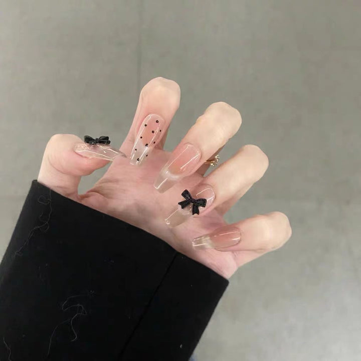 Artificial nails with playful bow design Stornfield