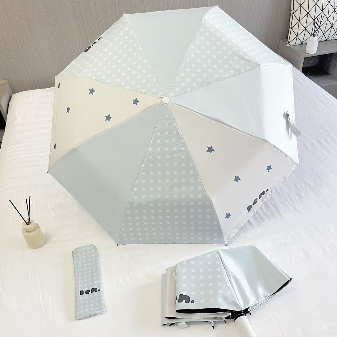 Women's folding umbrella with unique star pattern and practical carrying bag Stornfield