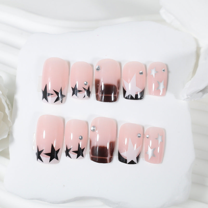 Acrylic nail set with glamorous star and glitter accents Stornfield
