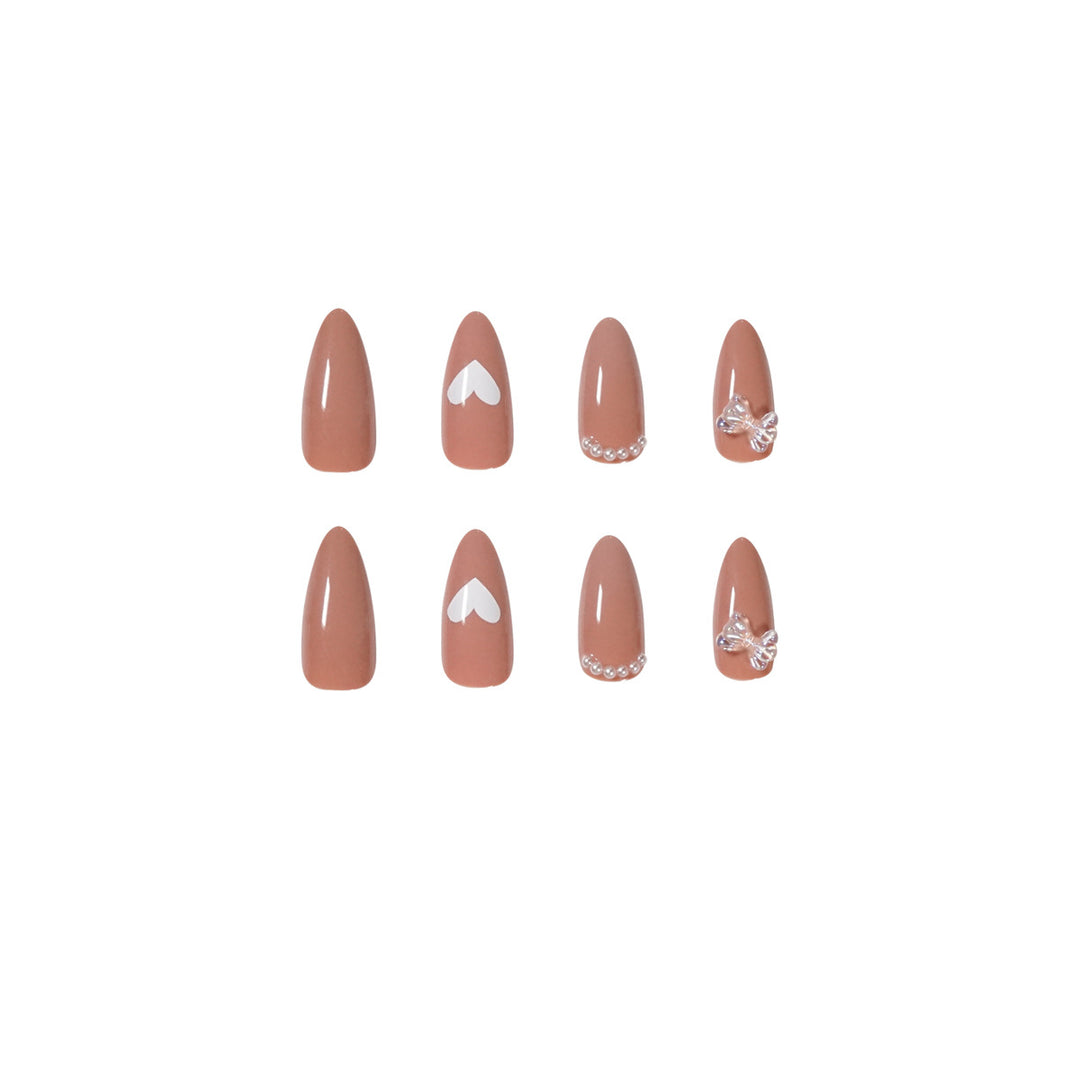 Elegant artificial nails with heart-shaped and glitter accents Stornfield
