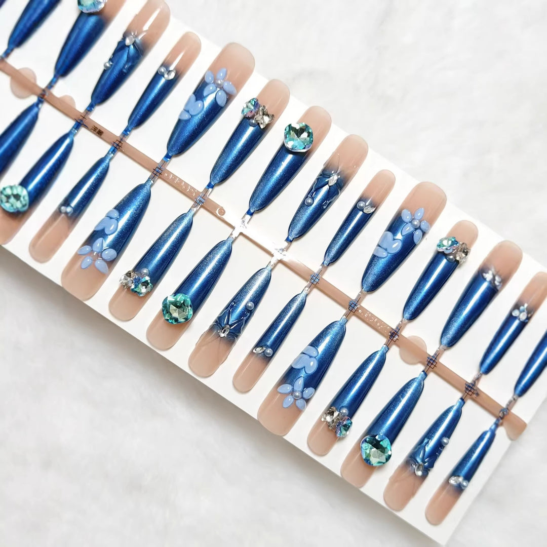 Elegant artificial nails with floral applications and glitter elements Stornfield