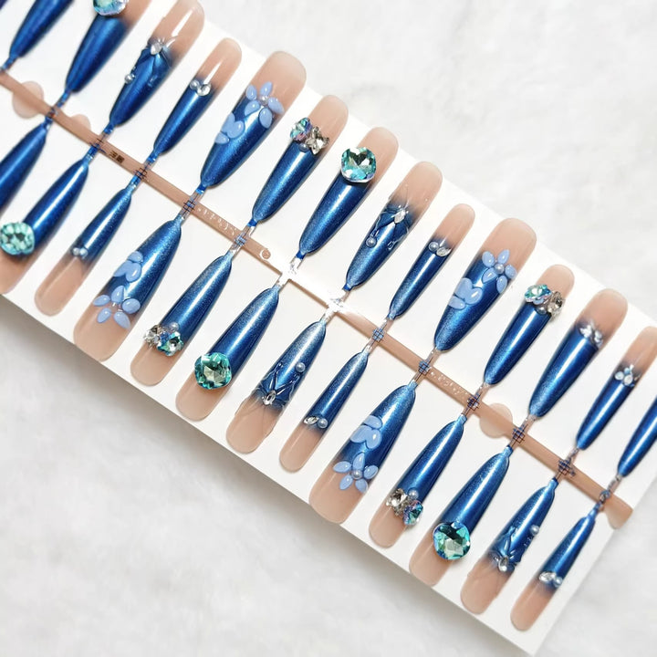 Elegant artificial nails with floral applications and glitter elements Stornfield