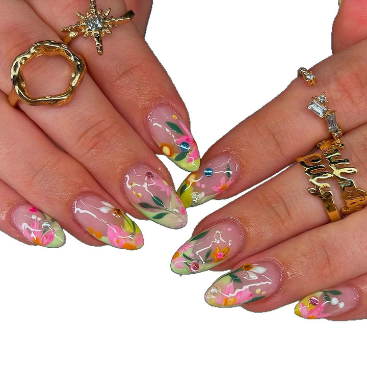 Artificial nails with flower design and glitter accents Stornfield